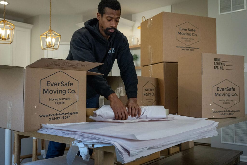 EverSafe Moving Co. mover providing packing services.