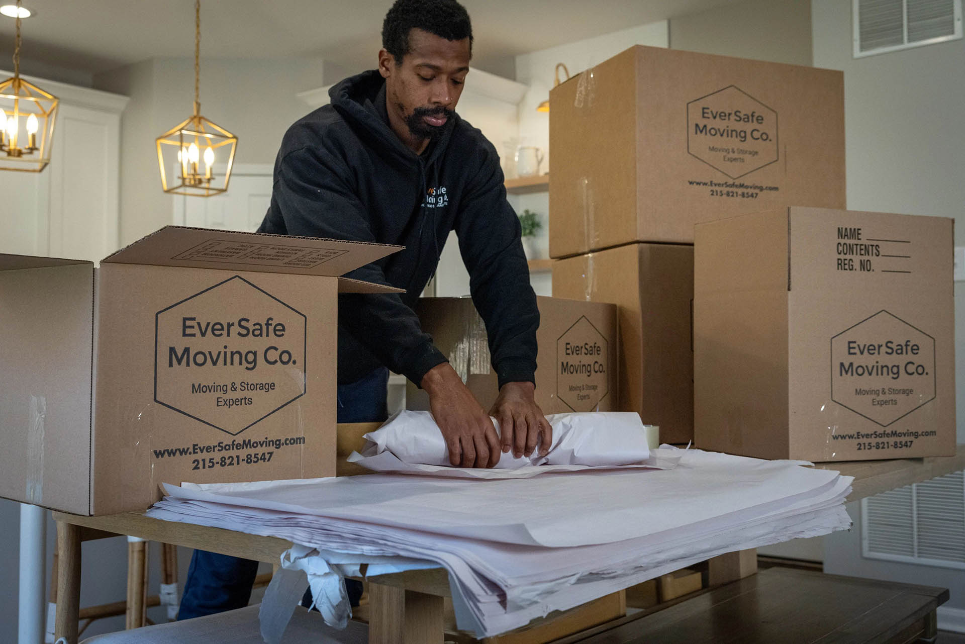 EverSafe Moving Co. mover providing packing services.