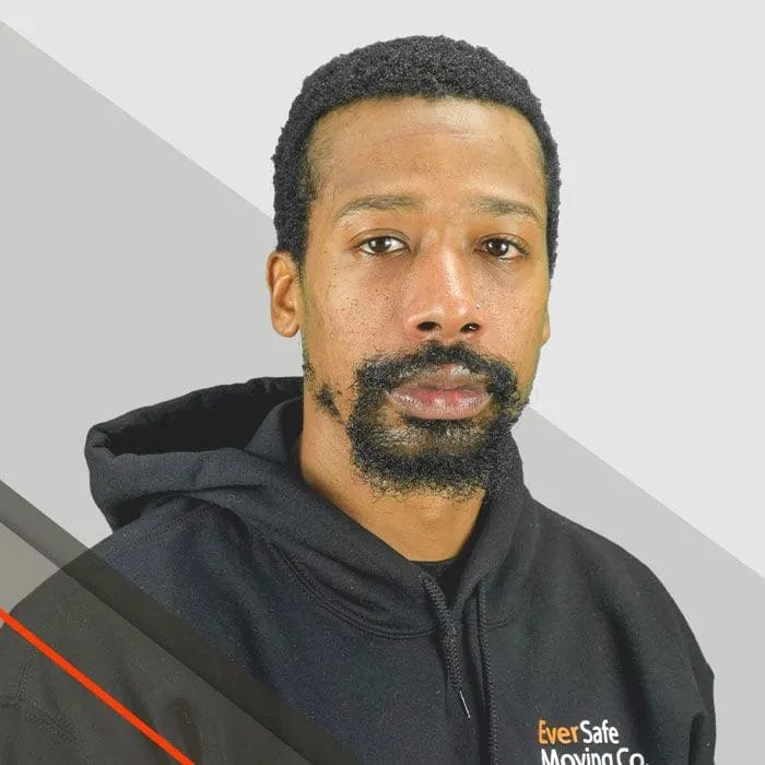 Tracey, Mover, with a focused expression wears an EverSafe hoodie