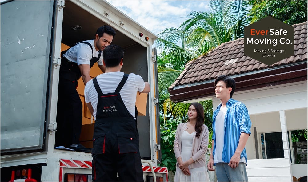 Eversafe Mover service truck parked as couple watches during home relocation
